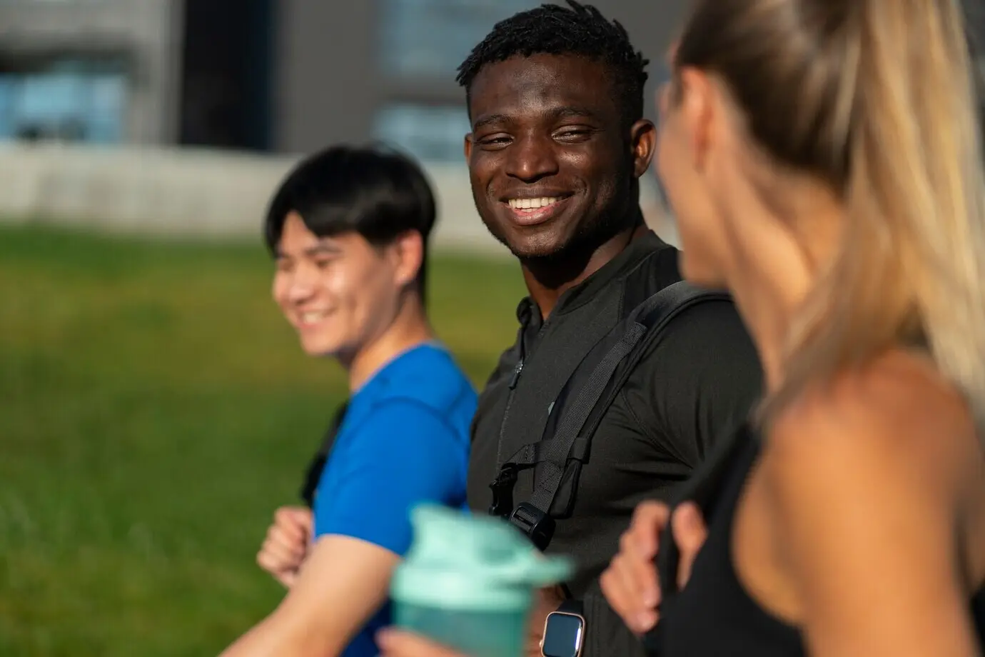 Side view of physically fit friends outdoors